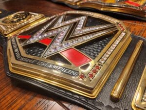 Close-up of WWE World Heavyweight replica belt 16MM CNC center plate with 24K gold plating cubic zirconia stones and deep etching