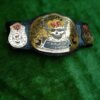 Side profile of WWF Smoking Skull Championship Belt showing thickness of 4mm zinc plates and leather strap depth