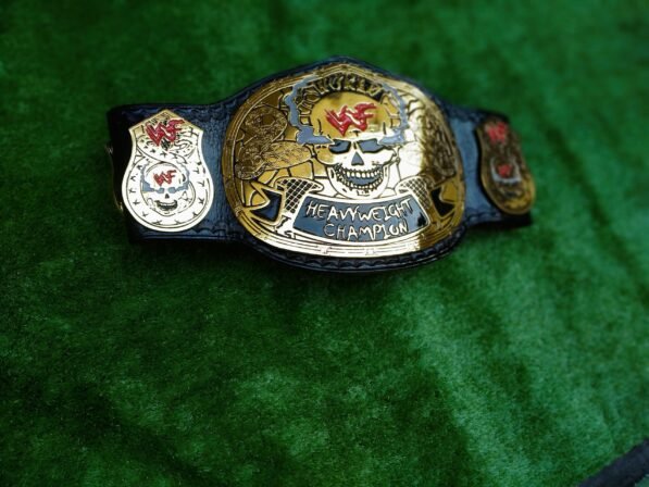 Side profile of WWF Smoking Skull Championship Belt showing thickness of 4mm zinc plates and leather strap depth