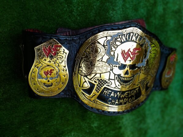 Side profile of WWF Smoking Skull Championship Belt showing thickness of 4mm zinc plates and leather strap depth
