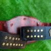 Back view of WWF Smoking Skull Championship Belt displaying authentic snake skin pattern leather and metal backing plates