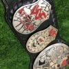 Close-up of WWF Smoking Skull Belt silver side plates with double etching and championship engravings