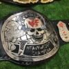 Side profile of WWF Smoking Skull Championship Belt showing 4mm silver zinc plate thickness and strap depth