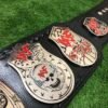 Close-up of WWF Smoking Skull Belt silver side plates with double etching and championship engravings