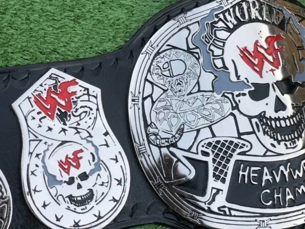 Side profile of WWF Smoking Skull Championship Belt showing 4mm silver zinc plate thickness and strap depth