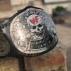 Front view of WWF Smoking Skull Championship Belt with 4mm silver zinc plates, black leather strap, and skull centerpiece design