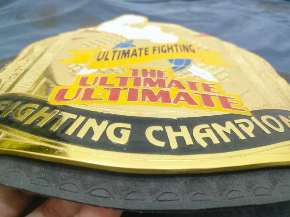 Old UFC SuperFight championship belt main center plate with chrome finish detail