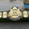 WWF heavyweight championship belt winged eagle detail showing CNC precision etching and craftsmanship