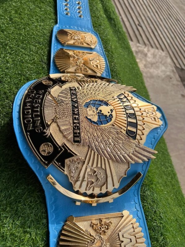 WWF Winged Eagle Championship Belt side profile showing 4mm blue leather strap thickness, CNC zinc plate depth, and snap fasteners