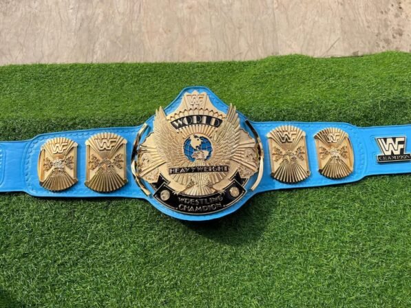 WWF Winged Eagle Championship Belt full layout showing complete 50-inch length with winged eagle plate, side plates, blue leather, CNC details