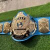 WWF Winged Eagle Championship Belt side profile showing 4mm blue leather strap thickness, CNC zinc plate depth, and snap fasteners