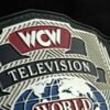 Close-up of WCW Television Championship Belt center plate showing deep CNC engraving and gold plating detail