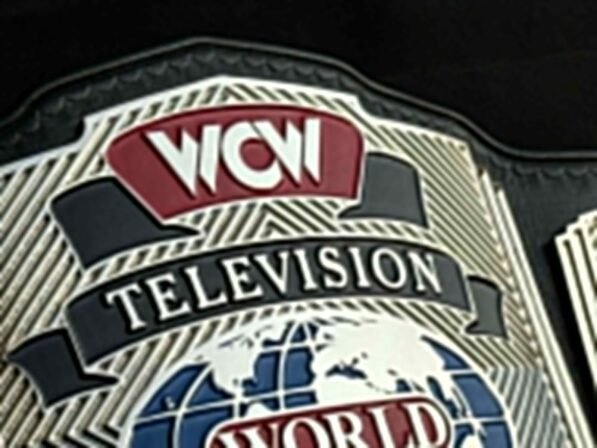 Close-up of WCW Television Championship Belt center plate showing deep CNC engraving and gold plating detail