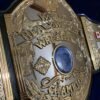 WWF Hulk Hogan championship belt center plate showing 4mm brass construction and gold plating detail
