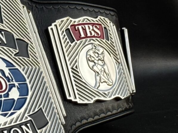 Side view of WCW Television Championship Belt showing 4mm thick plates and 6mm leather strap construction