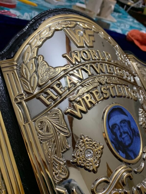 WWF Hulk Hogan championship belt center plate showing 4mm brass construction and gold plating detail