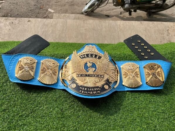 WWF Winged Eagle Championship Belt replica full layout showing complete 50-inch length with winged eagle plate, side plates, blue leather, CNC details