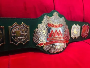 AAA Lucha Libre championship belt brass plate close view gold plating etching detail