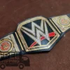 WWE World Heavyweight Championship Belt full layout showing complete 46-inch length with center plate, side plates, genuine leather strap, and gold finish