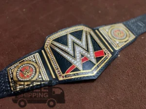 WWE World Heavyweight Championship Belt full layout showing complete 46-inch length with center plate, side plates, genuine leather strap, and gold finish
