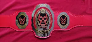Lucha Underground Trios championship belt brass plate close view gold etching detail