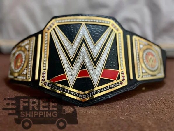 WWE World Heavyweight Wrestling Championship Title Belt front view showing center buckle plate with gold finish and 2mm brass construction