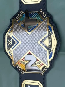 WWE NXT championship belt replica close view of gold plated zinc metal main plate