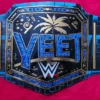 Close-up detail of YEET Belt showing 2mm brass plate engraving, gold finish texture, leather stitching, and Jey Uso championship quality