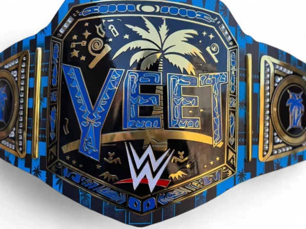 Close-up detail of YEET Belt showing 2mm brass plate engraving, gold finish texture, leather stitching, and Jey Uso championship quality