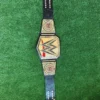 WWE Undisputed Championship Belt full layout showing complete 46-inch length with center plate, side plates, genuine leather strap, and gold finish