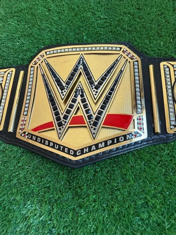 WWE Undisputed Championship Belt front view showing center plate with gold finish, 2mm brass construction, and authentic champion design