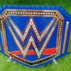 Blue universal belt 2mm brass metal plates with authentic WWE championship design close up detail