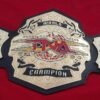 TNA Championship Belts with the red Background.
