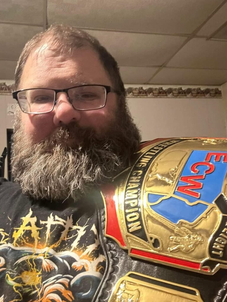 White man carrying the ECW championship belt