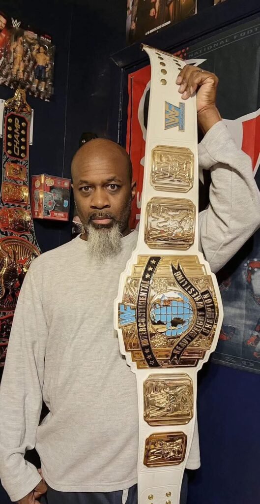 UK man carrying the White WWF championship belt on his shoulder