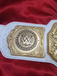 White polyurethane synthetic leather strap of WWE Women's World Heavyweight Championship replica belt with snap fasteners by Absolute Belts